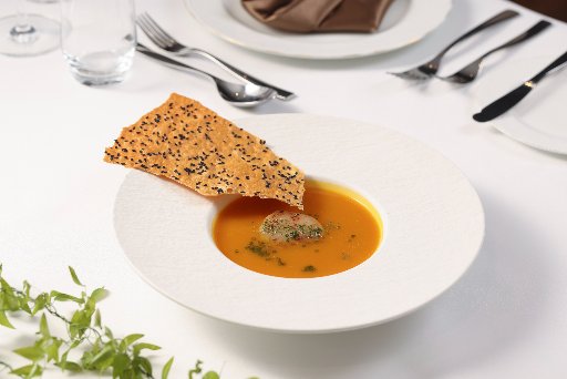 Pumpkin bisque with scallop and crisp bread chips